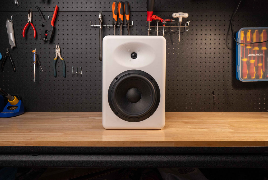 Finished Emanate 6 bookshelf speaker on a wooden bench